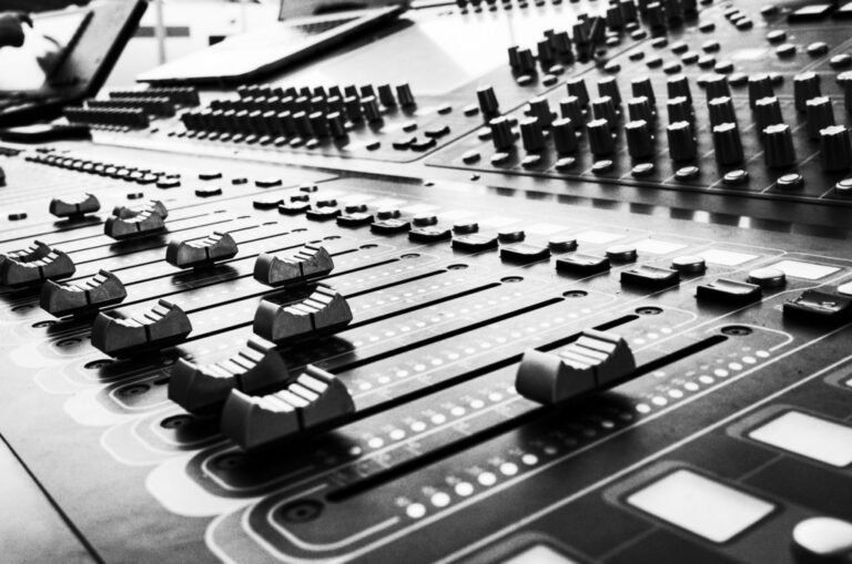 Pro mixing console showing channel strips and signal flow from input to output bus